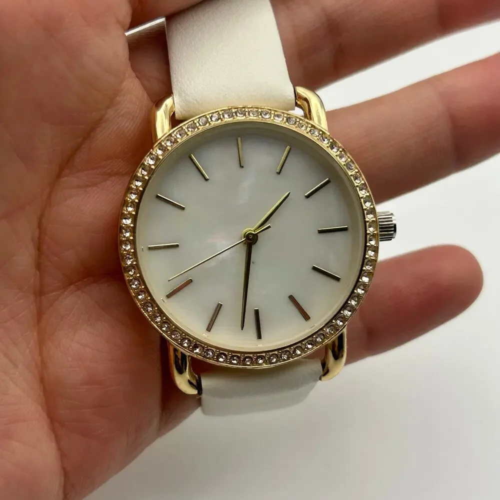 Women’s Gold-tone Crystal Bezel Mother Pearl Dial White Band Minimalist Watch